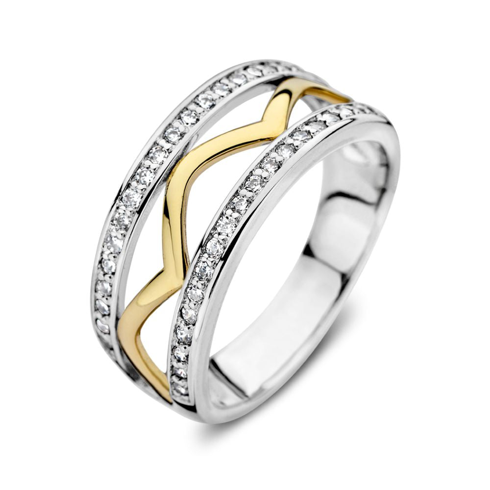 Anillo elegante de plata y oro amarillo de 14 quilates con circonitas brillantes.