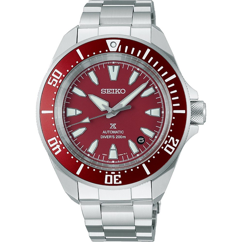 Reloj de buceo automático para hombre con esfera roja, caja de acero inoxidable y brazalete plateado.
