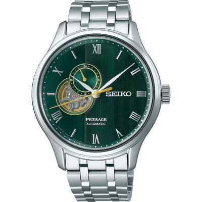 Reloj automático Seiko Presage con esfera verde, detalles en dorado y correa de acero inoxidable.