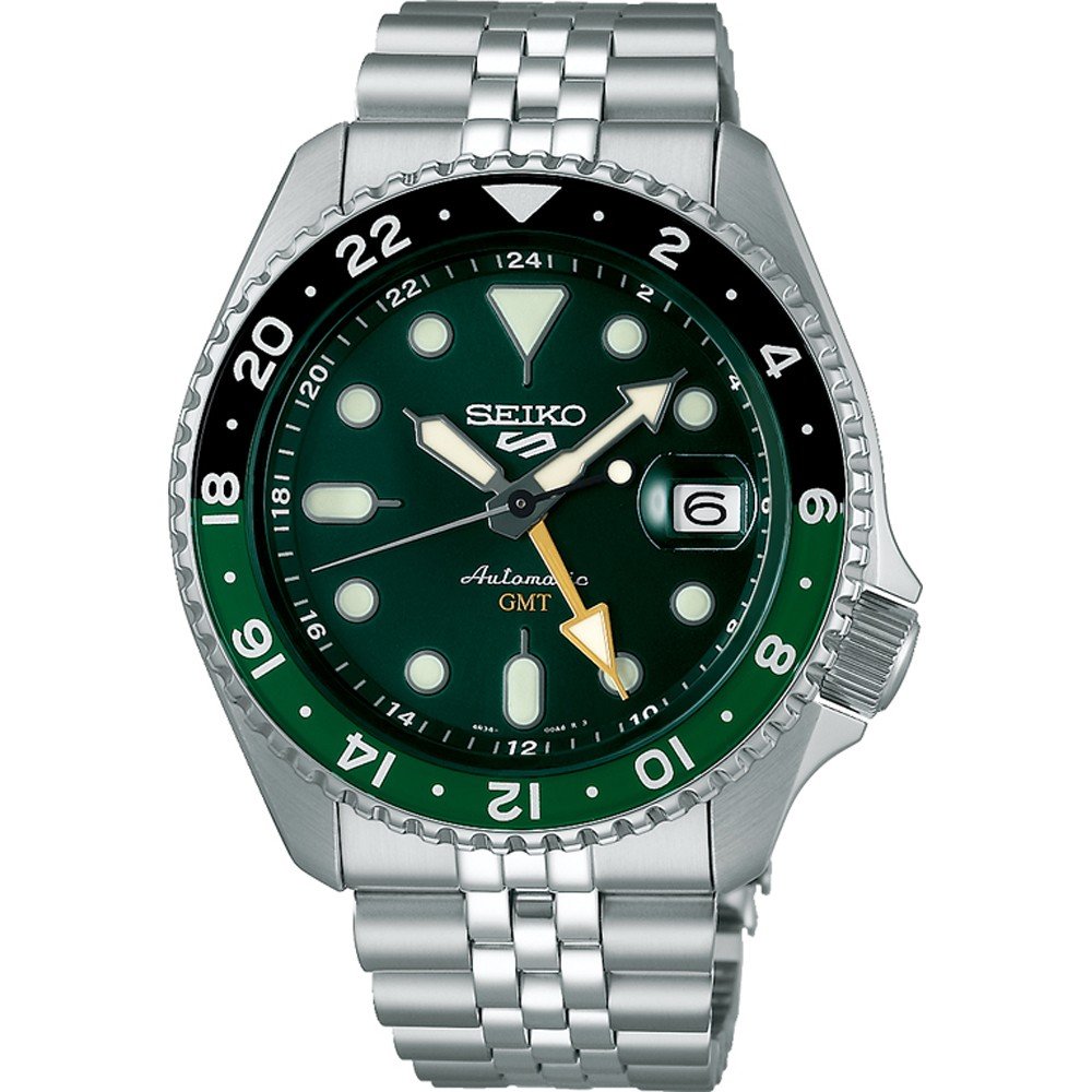 Reloj Seiko 5 Sports con esfera verde, bisel negro, correa de acero inoxidable y ventana de fecha.