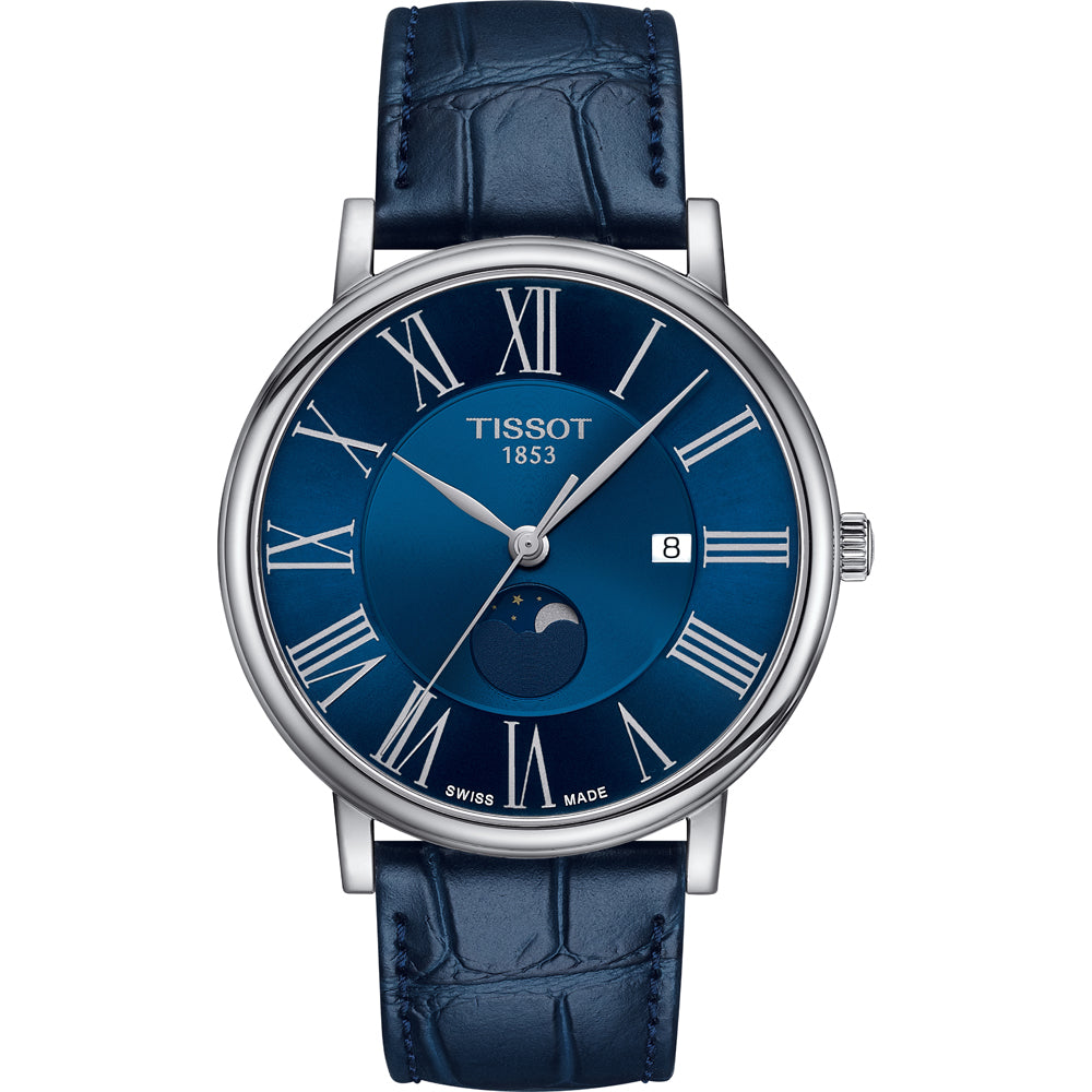 Reloj Tissot con esfera azul, números romanos, fase lunar y correa de piel azul.