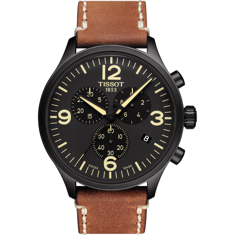 Reloj cronógrafo Tissot con esfera negra, correa de cuero marrón y detalles en color crema.