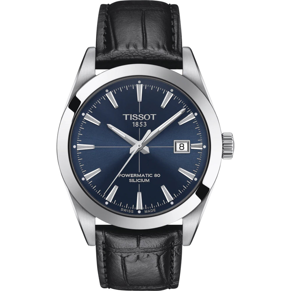 Reloj Tissot de esfera azul, caja de acero inoxidable, correa de cuero negro y fecha en la posición de las tres.