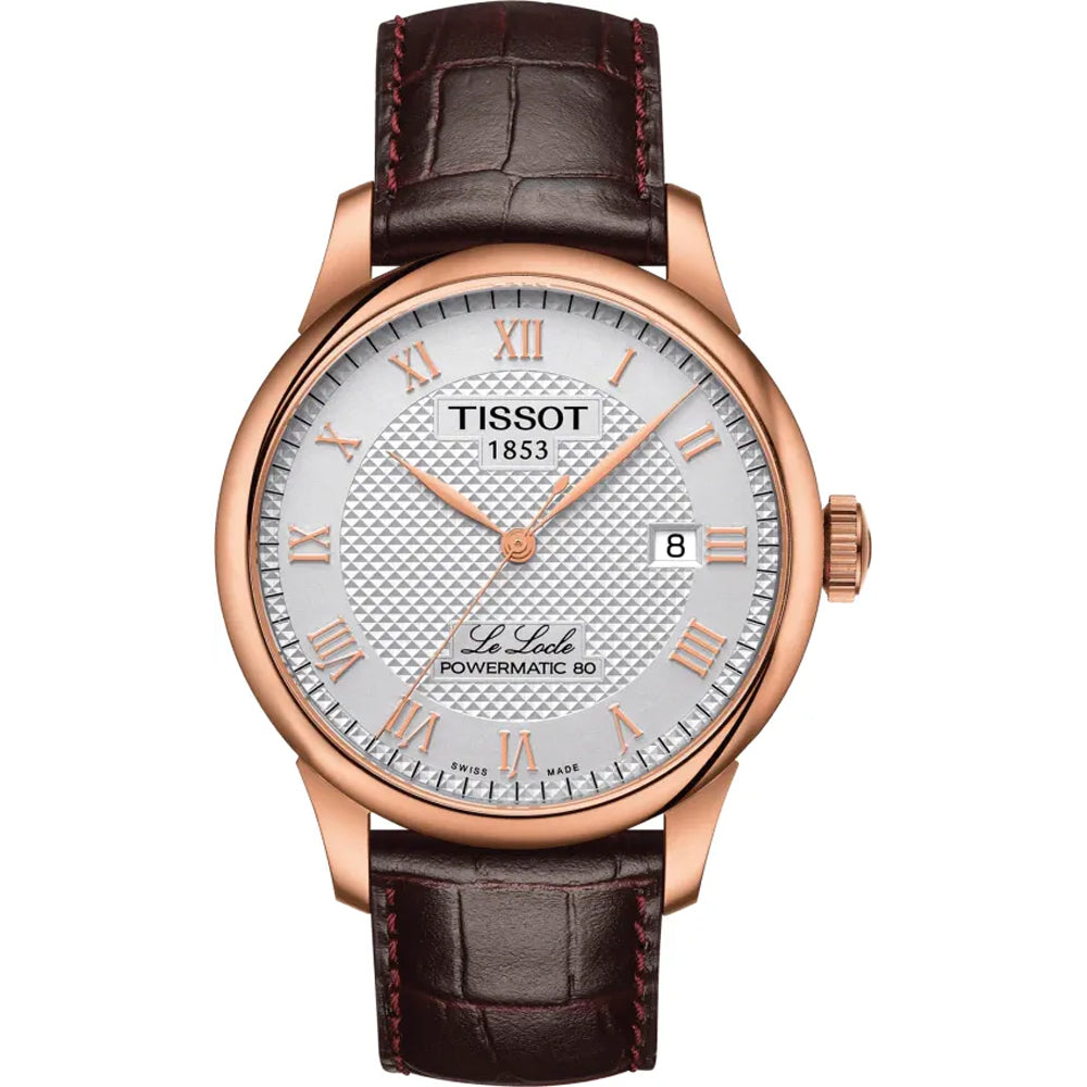 Reloj Tissot Le Locle con caja de acero rosa, esfera plateada y correa de cuero marrón.