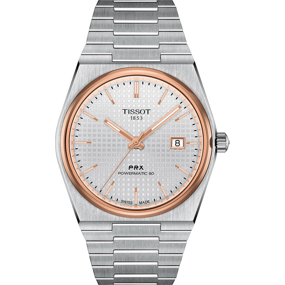Reloj Tissot PRX Powermatic 80 con caja plateada, esfera plateada y detalles en rosa, correa de acero.