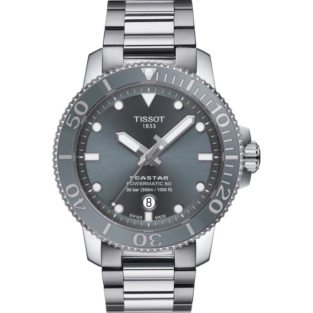 Reloj Tissot Seastar 1000 con esfera gris, bisel giratorio y correa de acero inoxidable.
