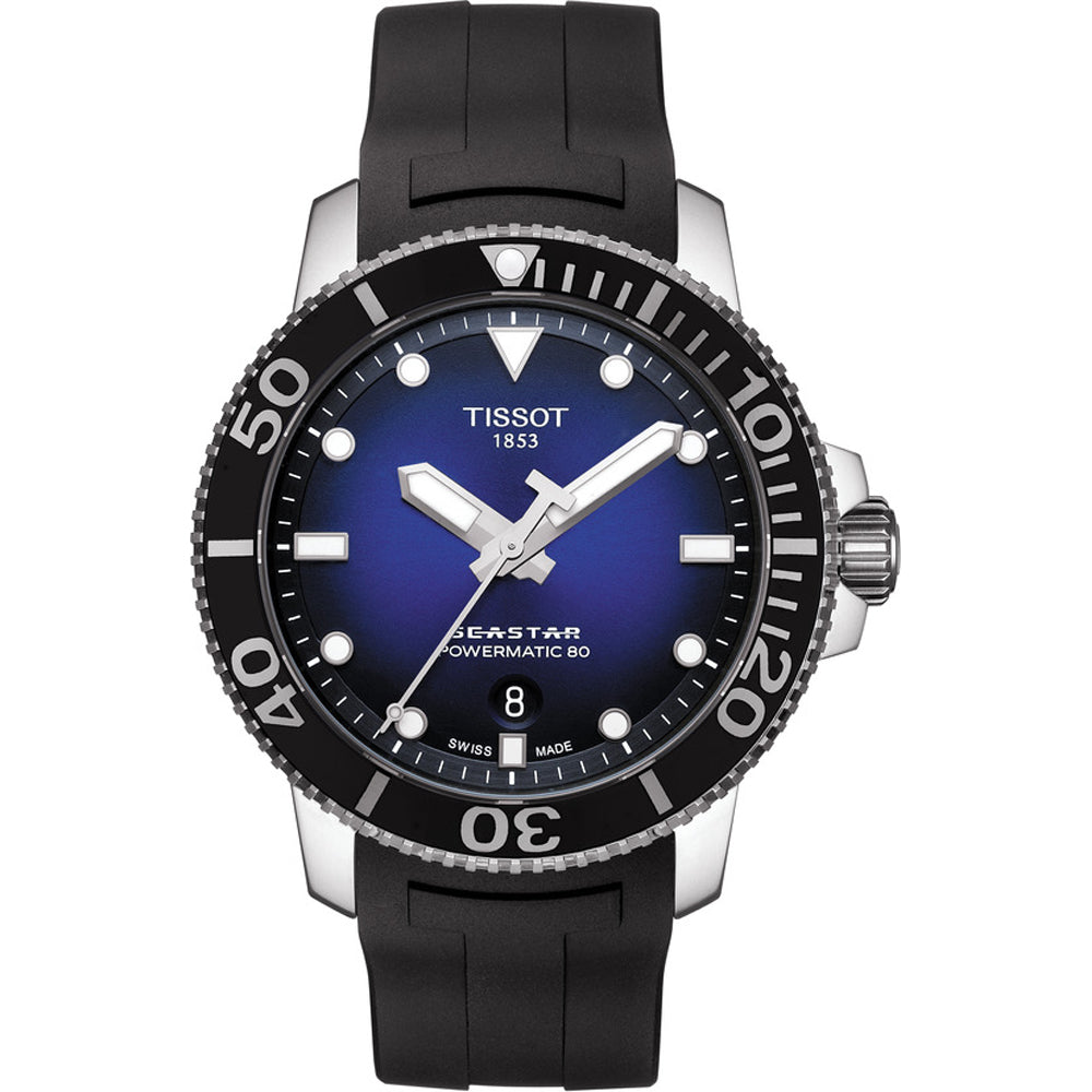 Reloj de buceo Tissot Seastar 1000 con esfera azul, correa de caucho negra y detalles plateados.