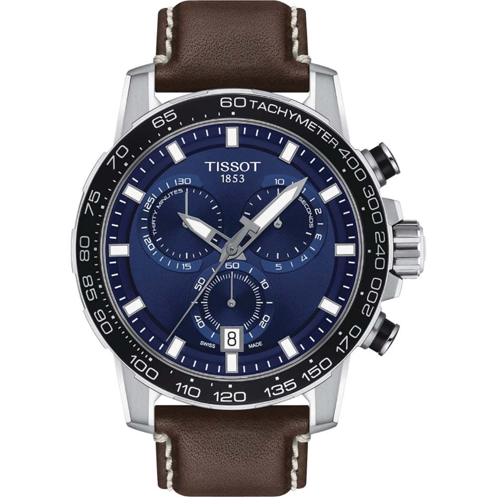 Reloj cronógrafo Tissot con esfera azul, caja de acero inoxidable y correa de cuero marrón.