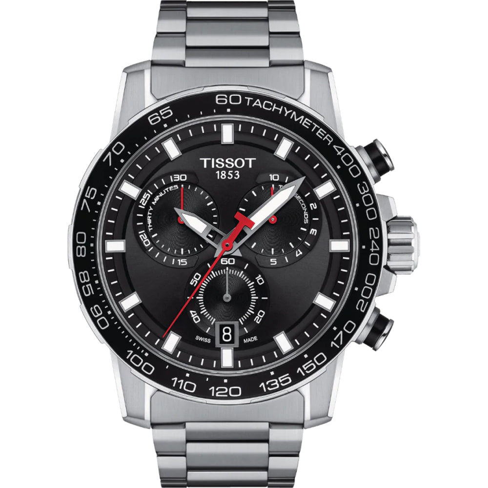 Reloj cronógrafo Tissot con esfera negra, detalles rojos y correa de acero inoxidable.
