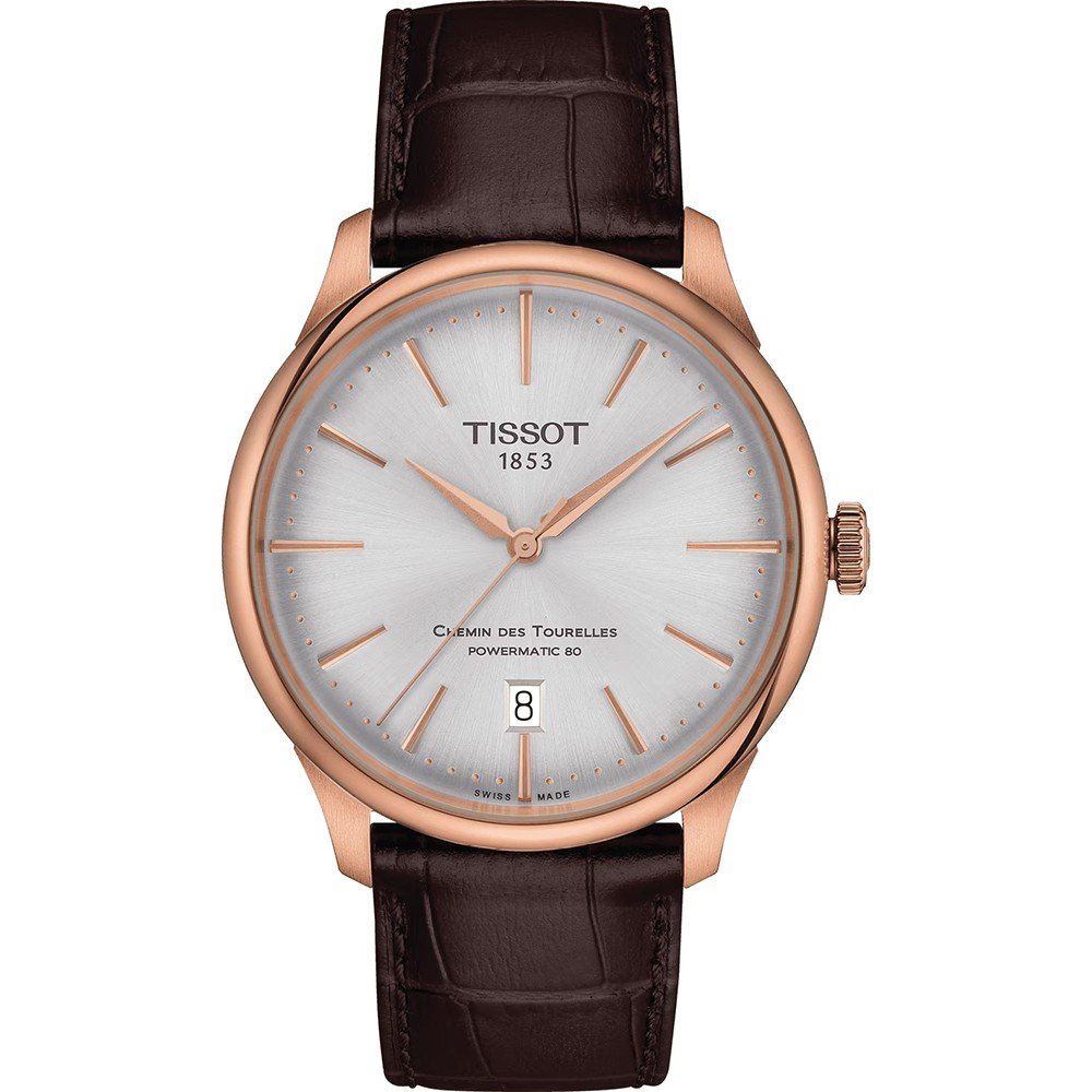 Reloj Tissot Chemin des Tourelles de 39 mm con caja rosa, esfera plateada y correa de piel marrón.
