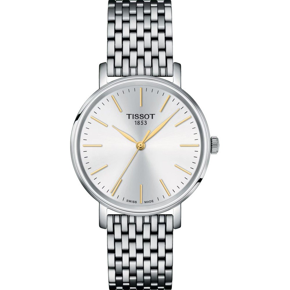 Reloj Tissot Everytime de 34 mm, con esfera plateada, manecillas doradas y correa de malla de acero inoxidable.