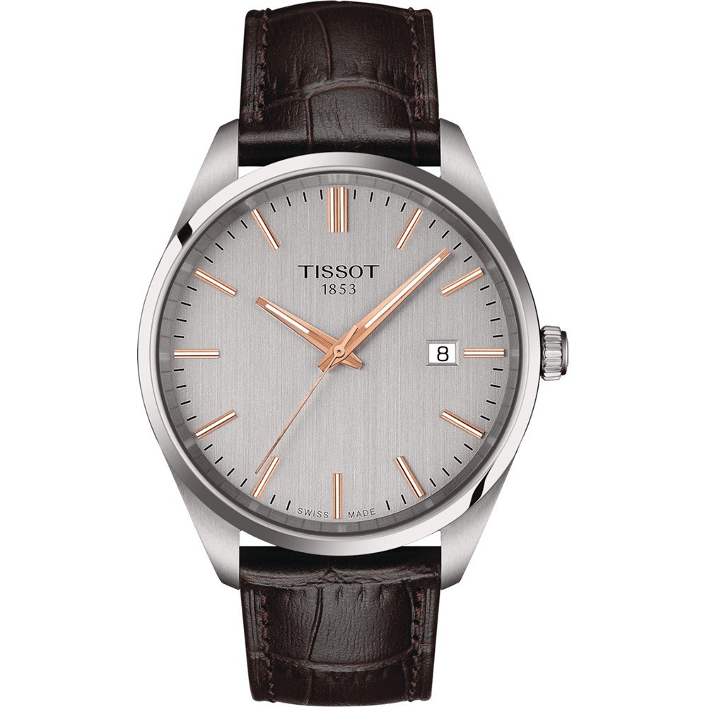 Reloj Tissot PR 100 con esfera plateada, índices y manecillas en rosa, correa de cuero marrón.