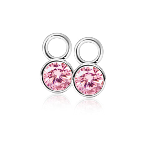 Pendientes de plata con circonitas rosas en forma redonda.