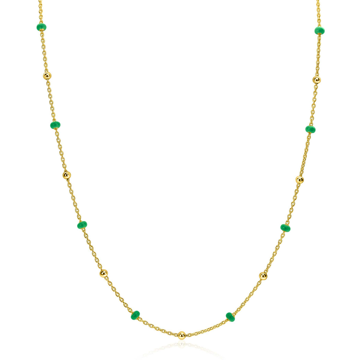 Cadena dorada con cuentas verdes y esferas brillantes.
