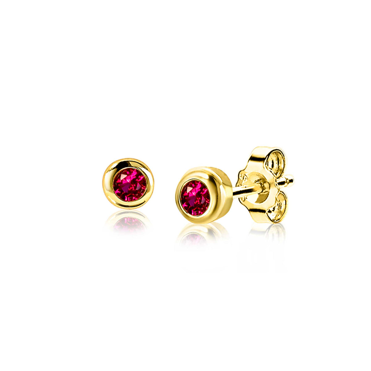 Pendientes de oro con piedra roja brillante.