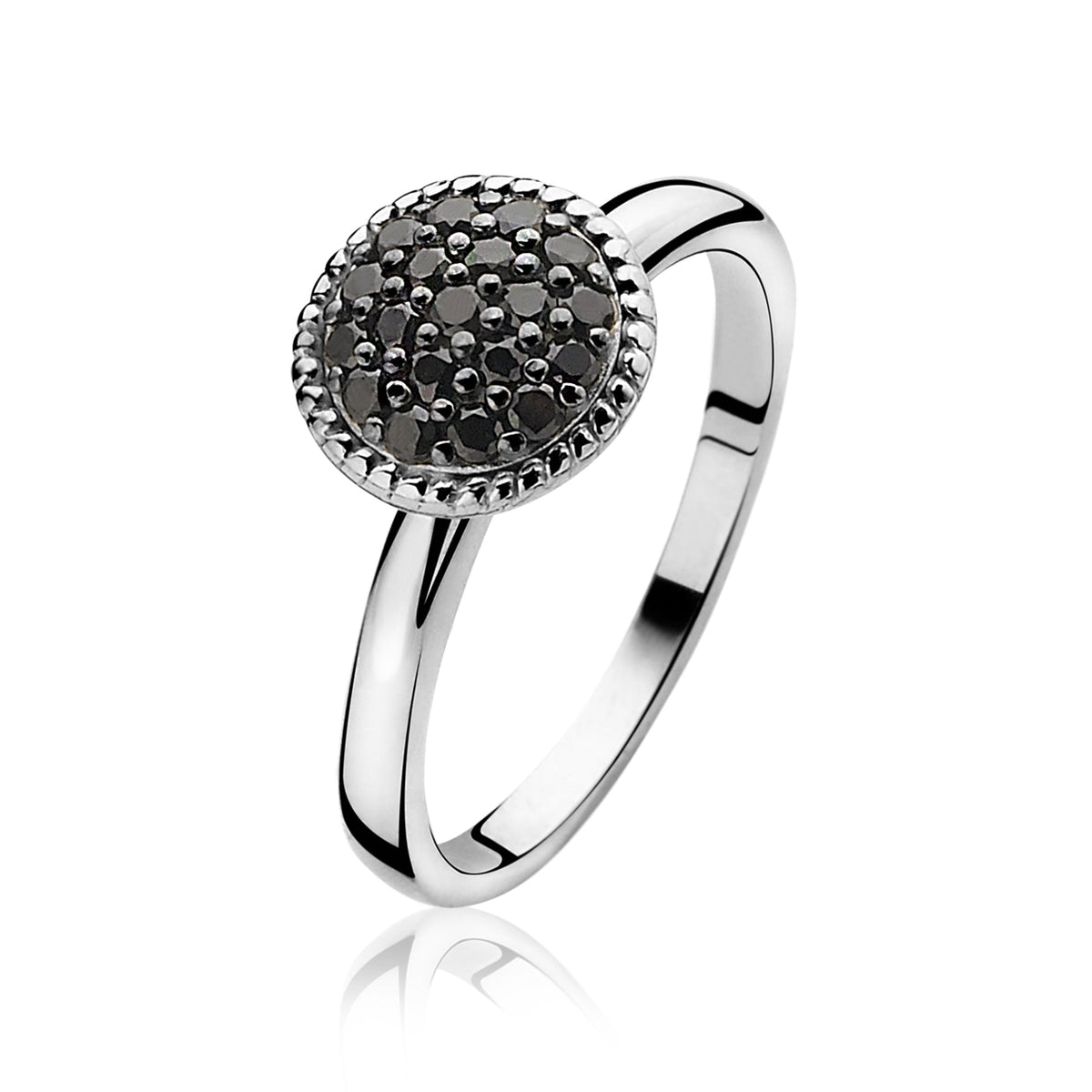 Anillo de plata con un diseño redondo y detalles en negro.