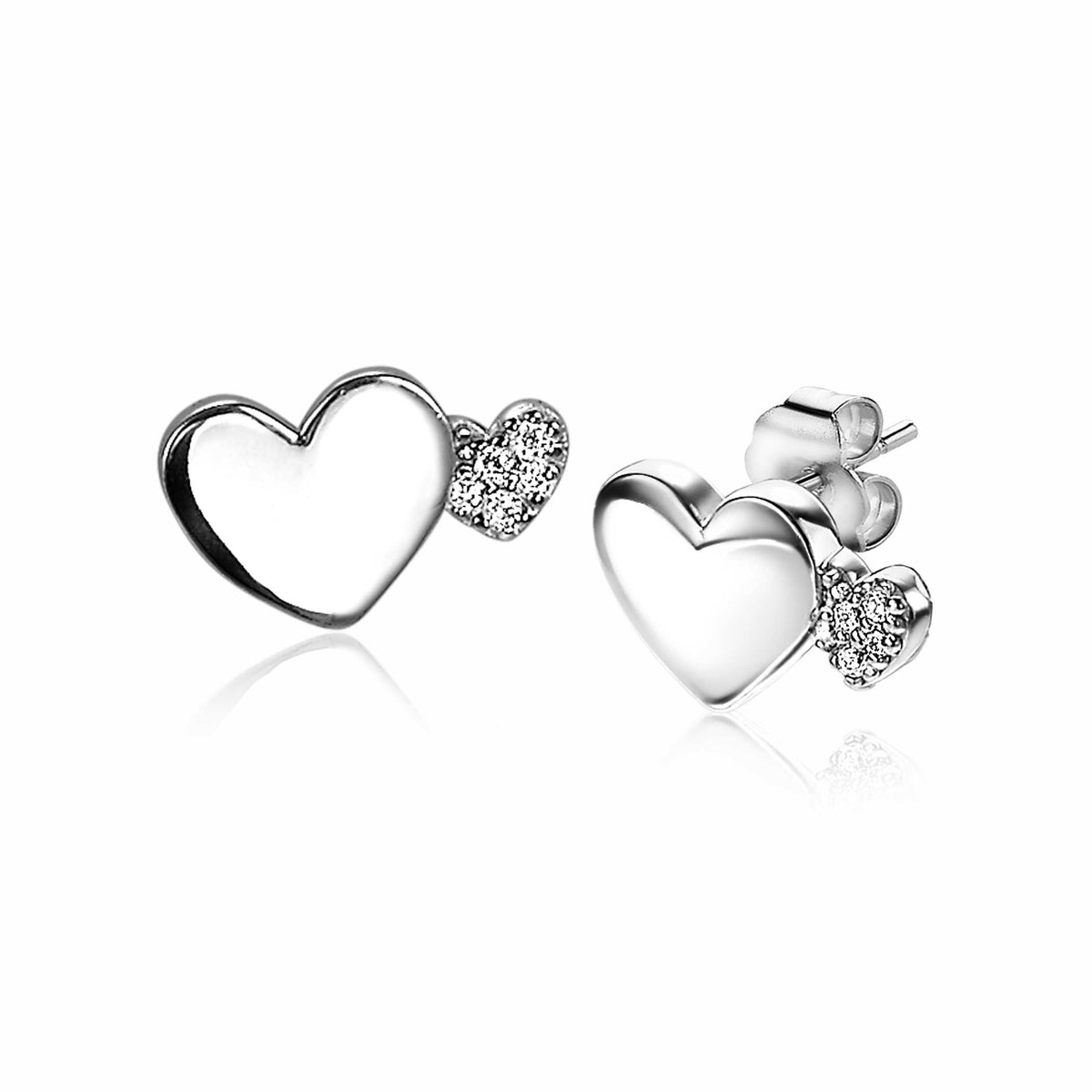 Pendientes de plata en forma de corazón con un pequeño corazón decorado con circonitas.