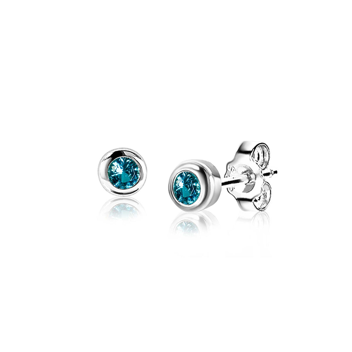 Pendientes de plata con piedras azules en forma de botón.