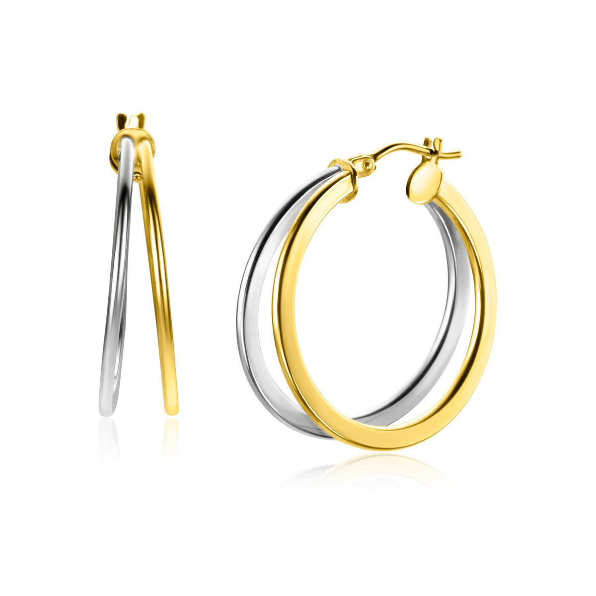 Pendientes de aro bicolor en oro y plata, con un diseño moderno y brillante.