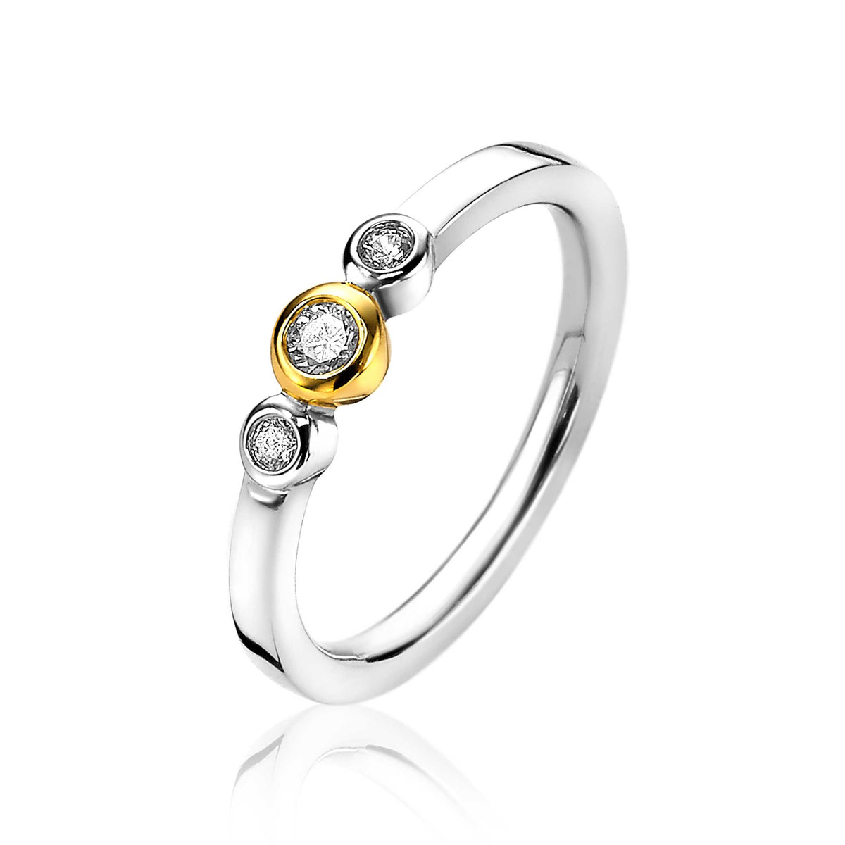 Anillo de plata con detalles en oro y tres circonitas brillantes.