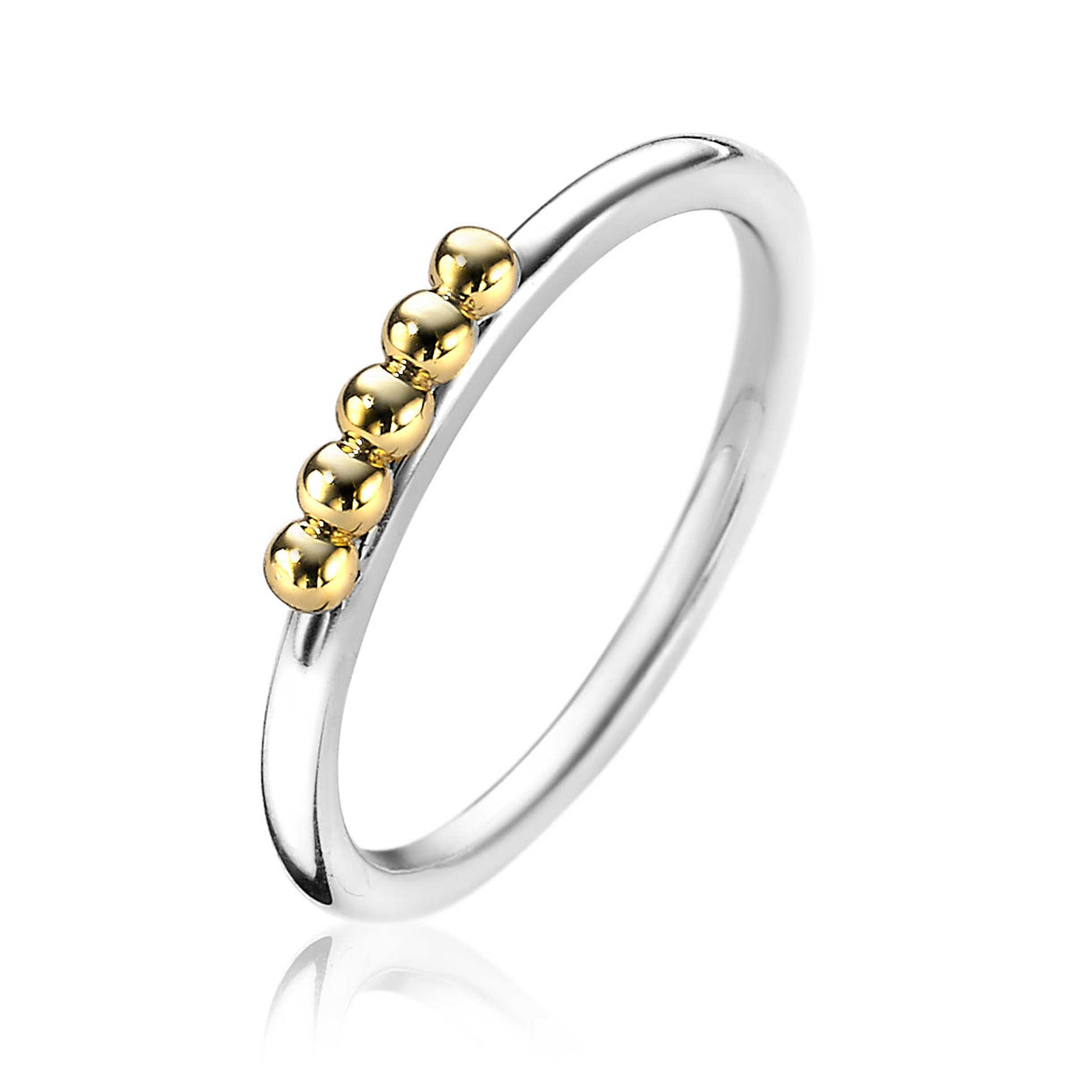 Anillo de plata con detalles en oro y cinco esferas brillantes.