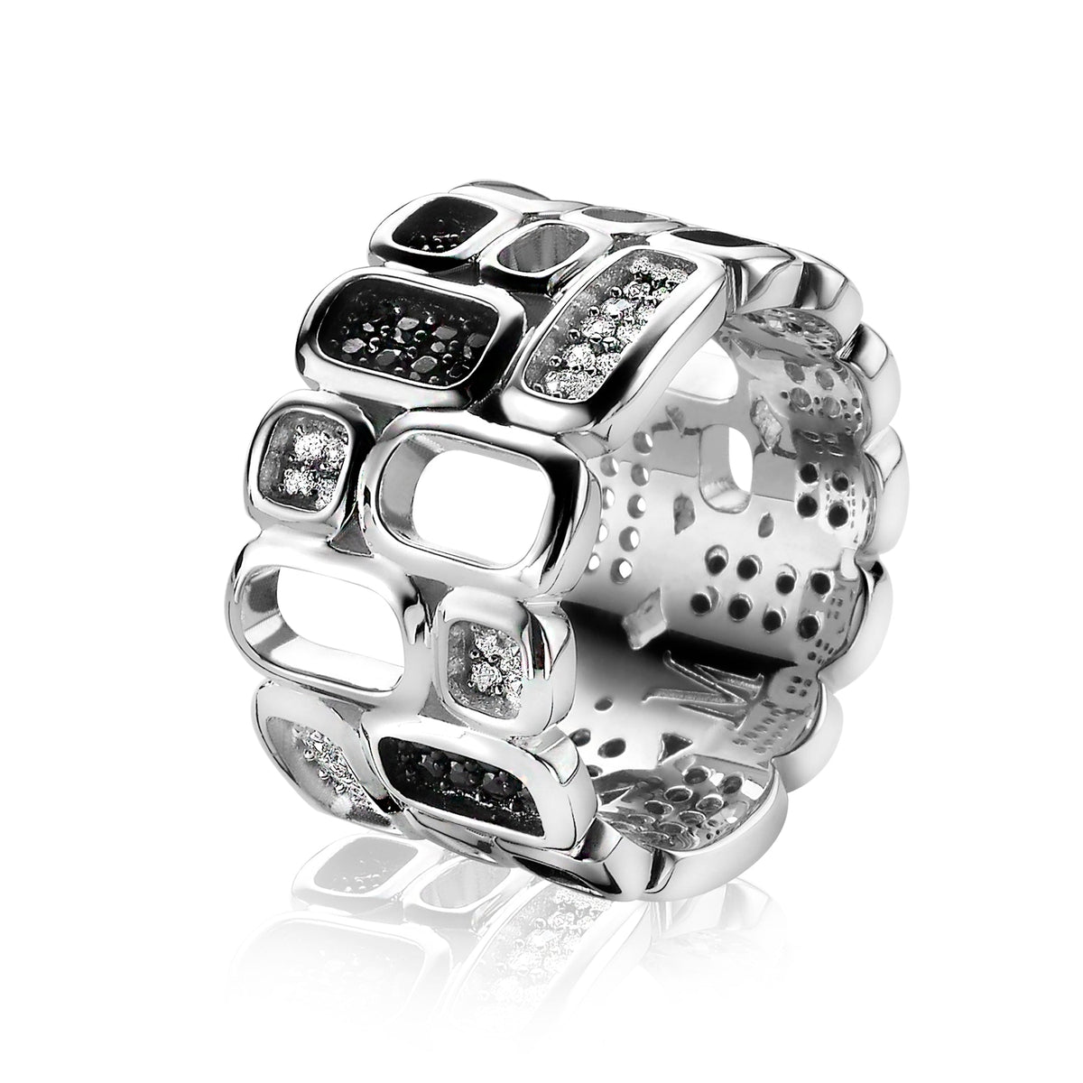 Anillo de plata con diseño moderno y detalles en negro y blanco, con formas rectangulares y cuadradas.