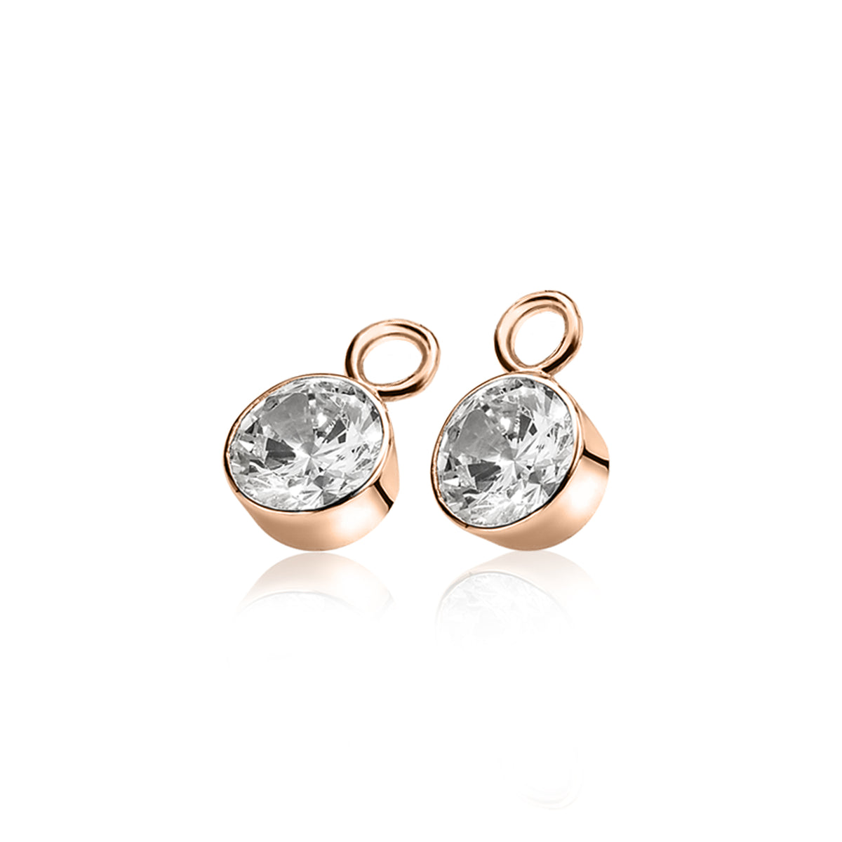 Pendientes de oro con piedra brillante y forma redonda.