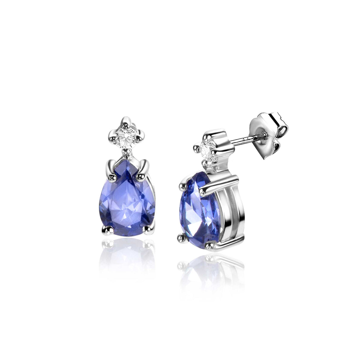 Pendientes de plata con forma de gota y piedra azul, adornados con un pequeño cristal brillante.