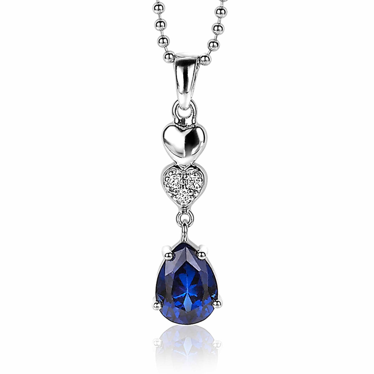 Colgante de plata con forma de corazón y piedra azul en forma de pera, adornado con circonitas.