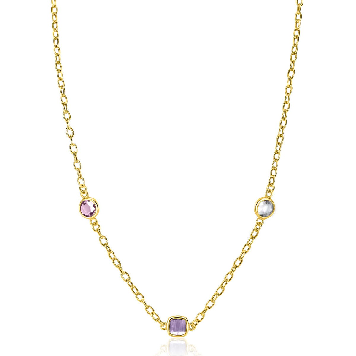 Cadena dorada con tres charms de piedras preciosas en tonos rosa y azul.