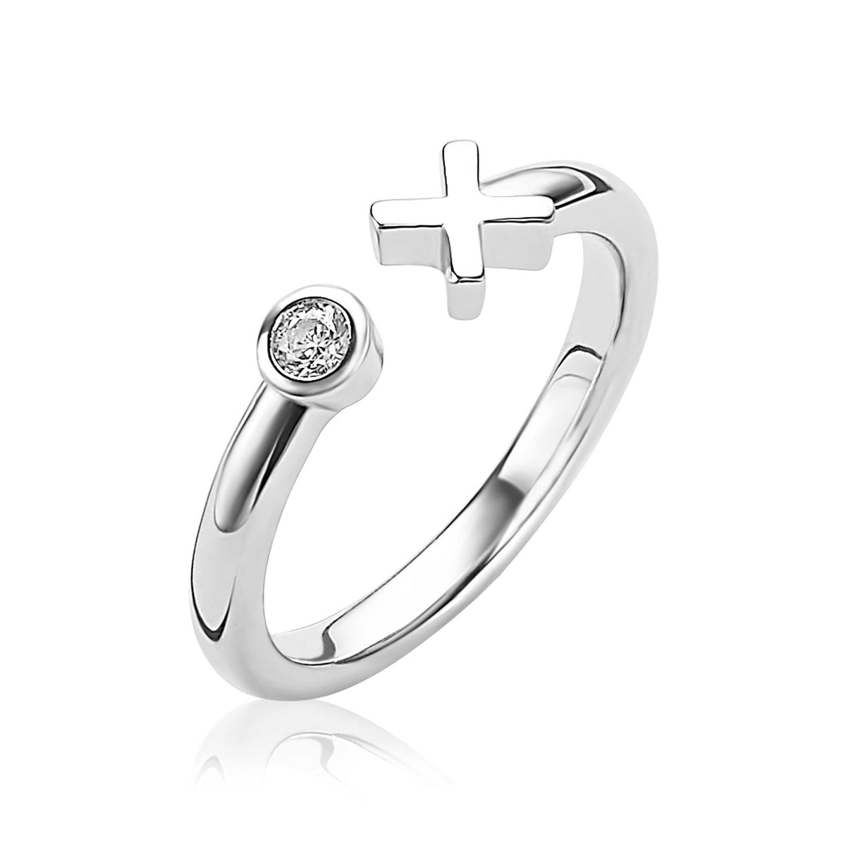 Anillo de plata con un cruz y una piedra brillante en un extremo.