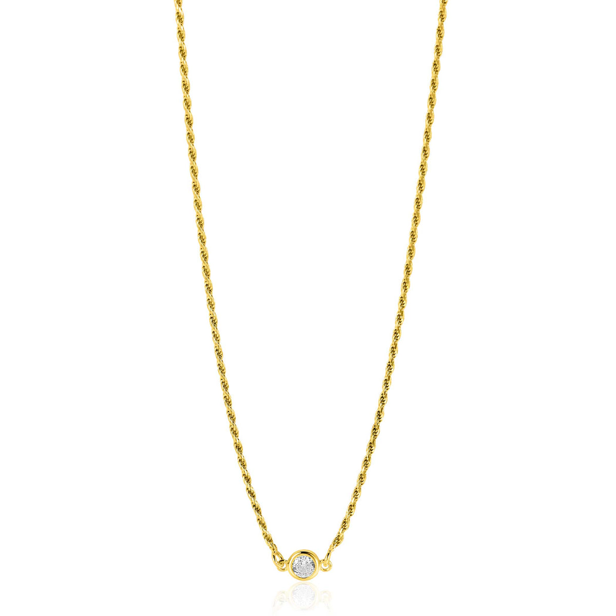 Cadena dorada con un diseño trenzado y un pequeño colgante con una piedra brillante.