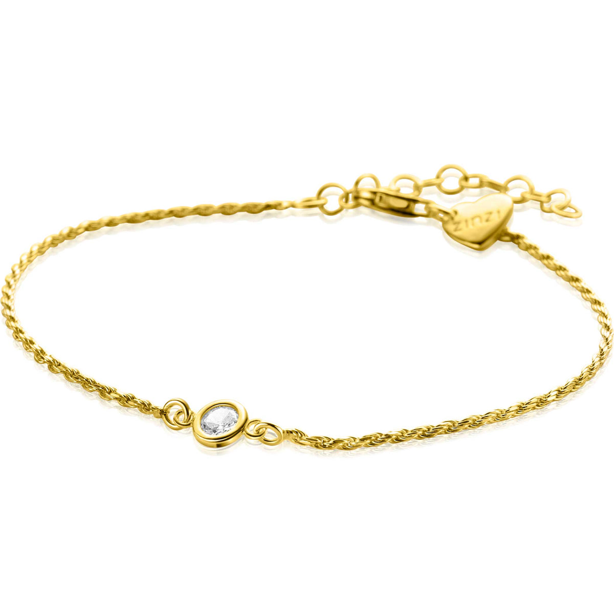 Pulsera dorada con cadena trenzada y un charm con piedra brillante.