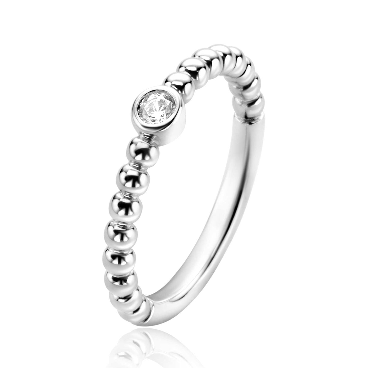 Anillo de plata con diseño de bolitas y una piedra brillante en el centro.