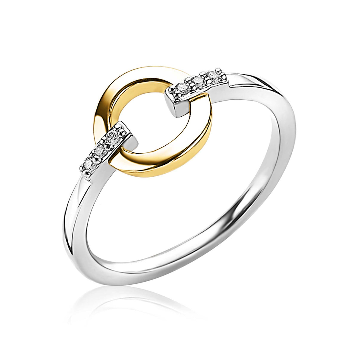 Anillo dorado y plateado con detalles de circonitas brillantes.