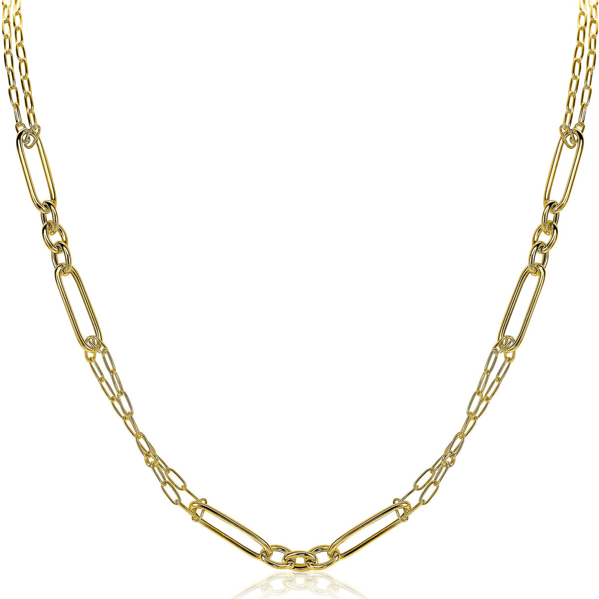 Collar dorado con eslabones alargados y detalles brillantes.