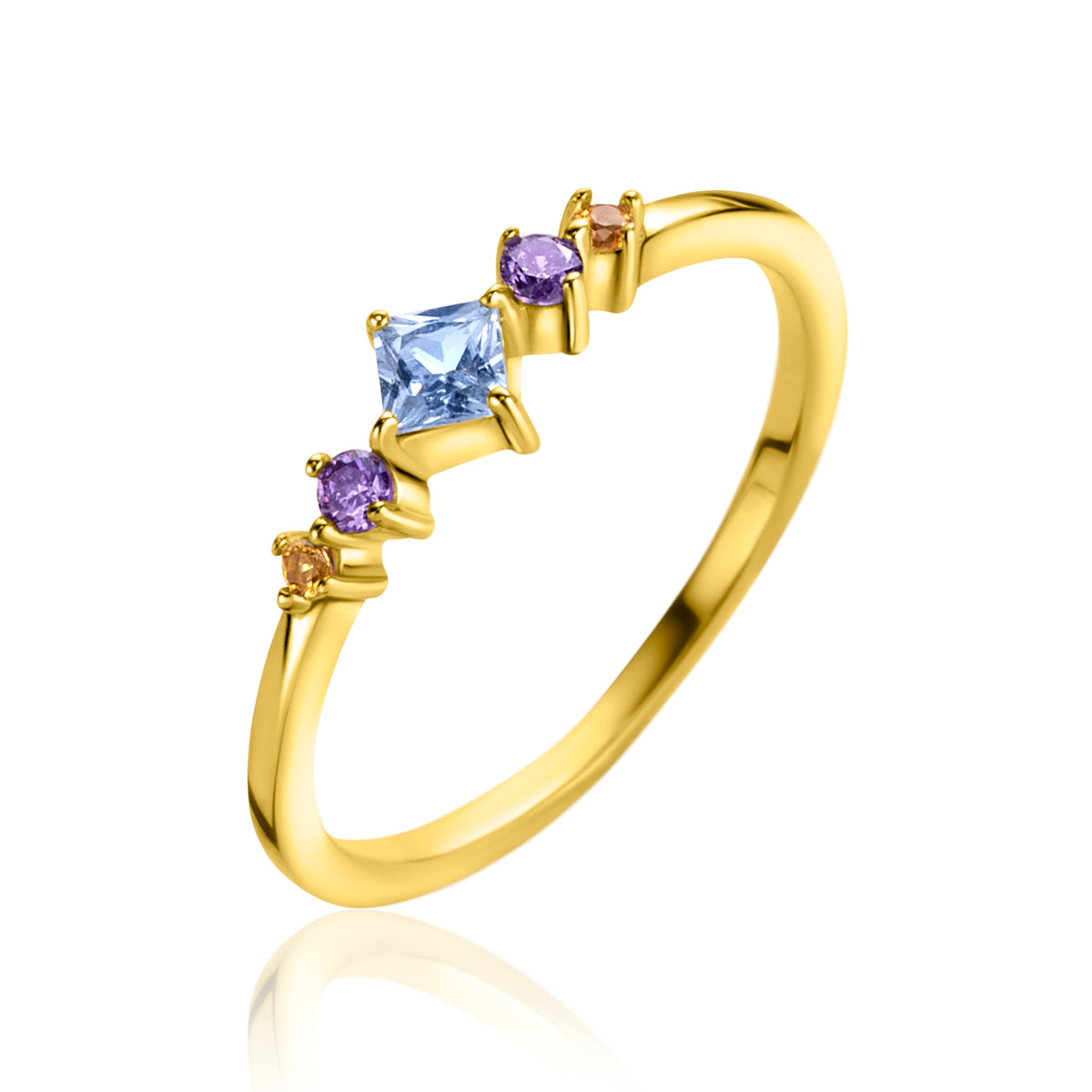Anillo dorado con piedras preciosas en tonos azul y púrpura.