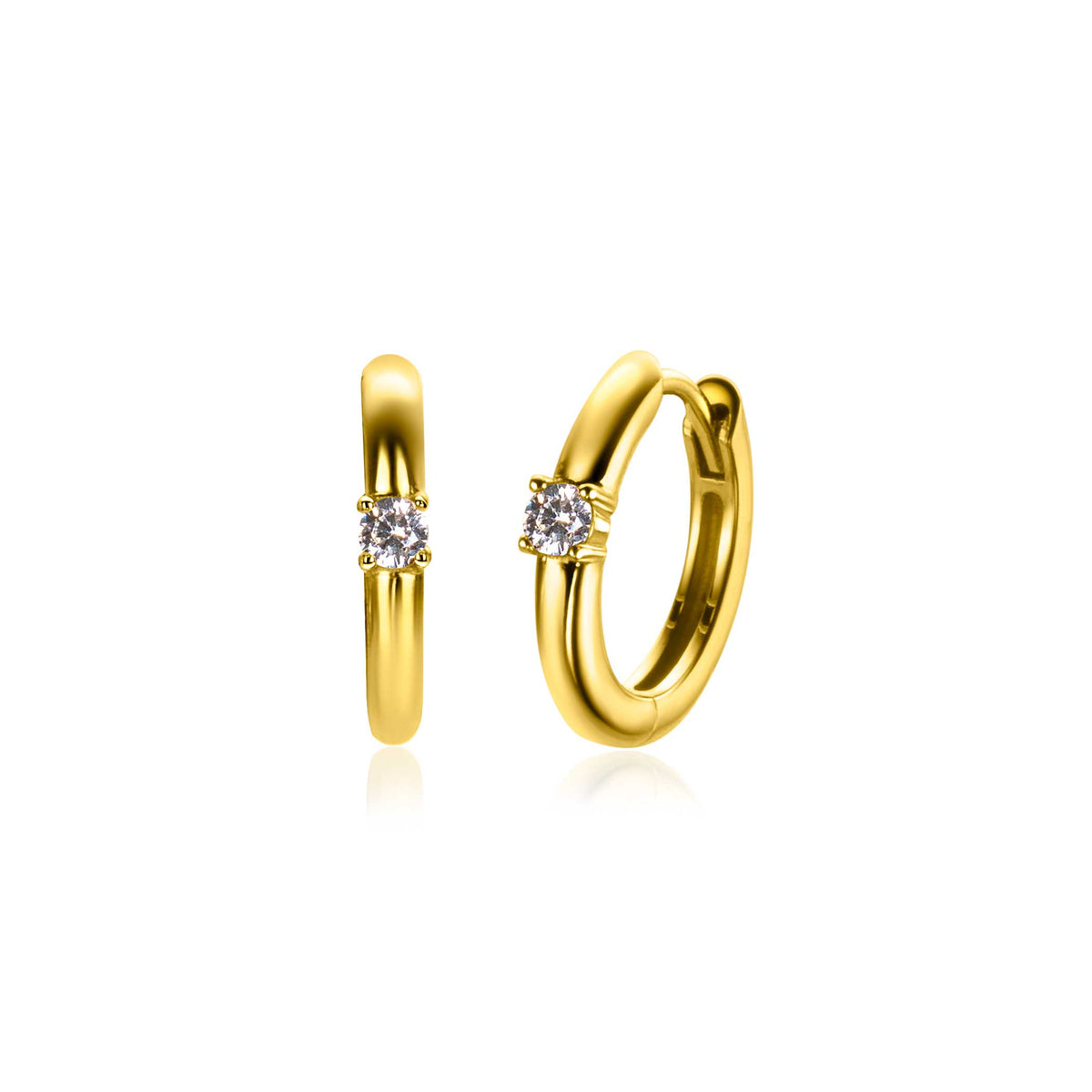Pendientes de aro dorados con un pequeño zirconia brillante en el centro.