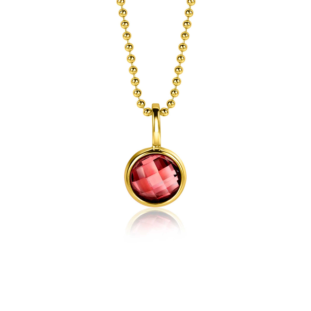 Colgante dorado con piedra roja facetada en cadena de bolitas.