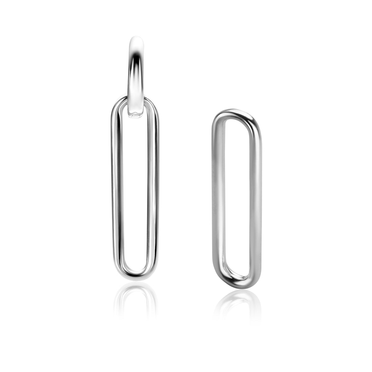 Pendientes largos de plata con forma ovalada y acabado pulido.