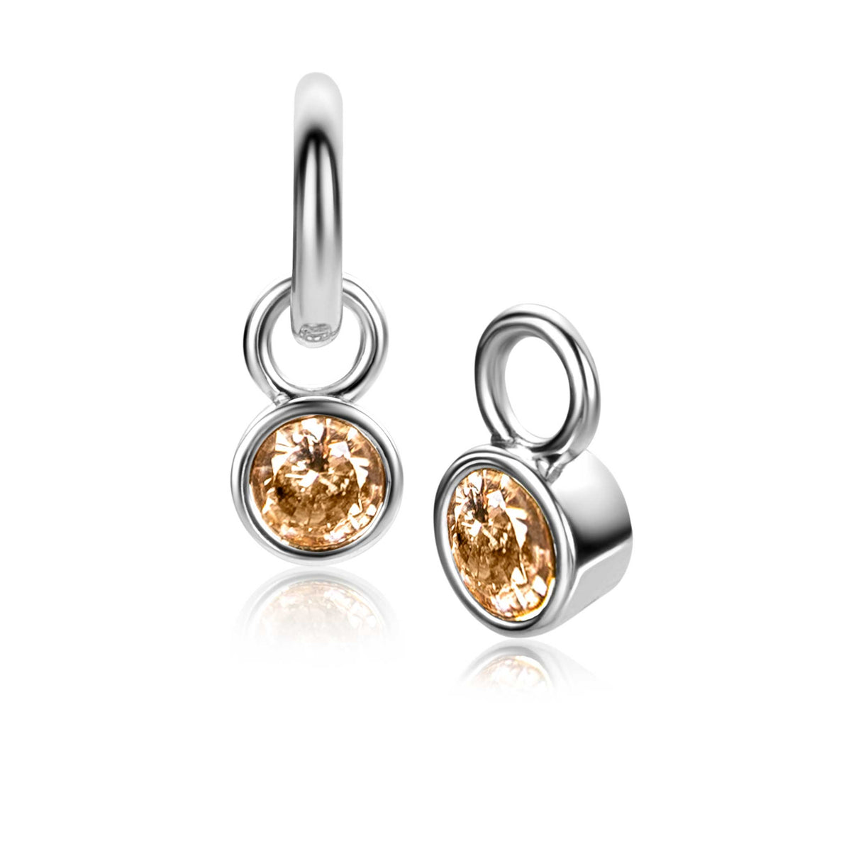 Pendientes de plata con circonitas en color ámbar, de forma redonda y colgantes.