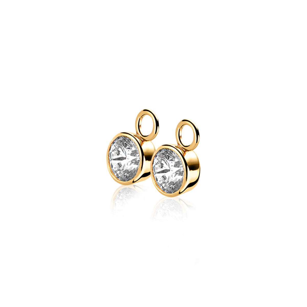 Pendientes de oro con un brillante cristal transparente en forma redonda.