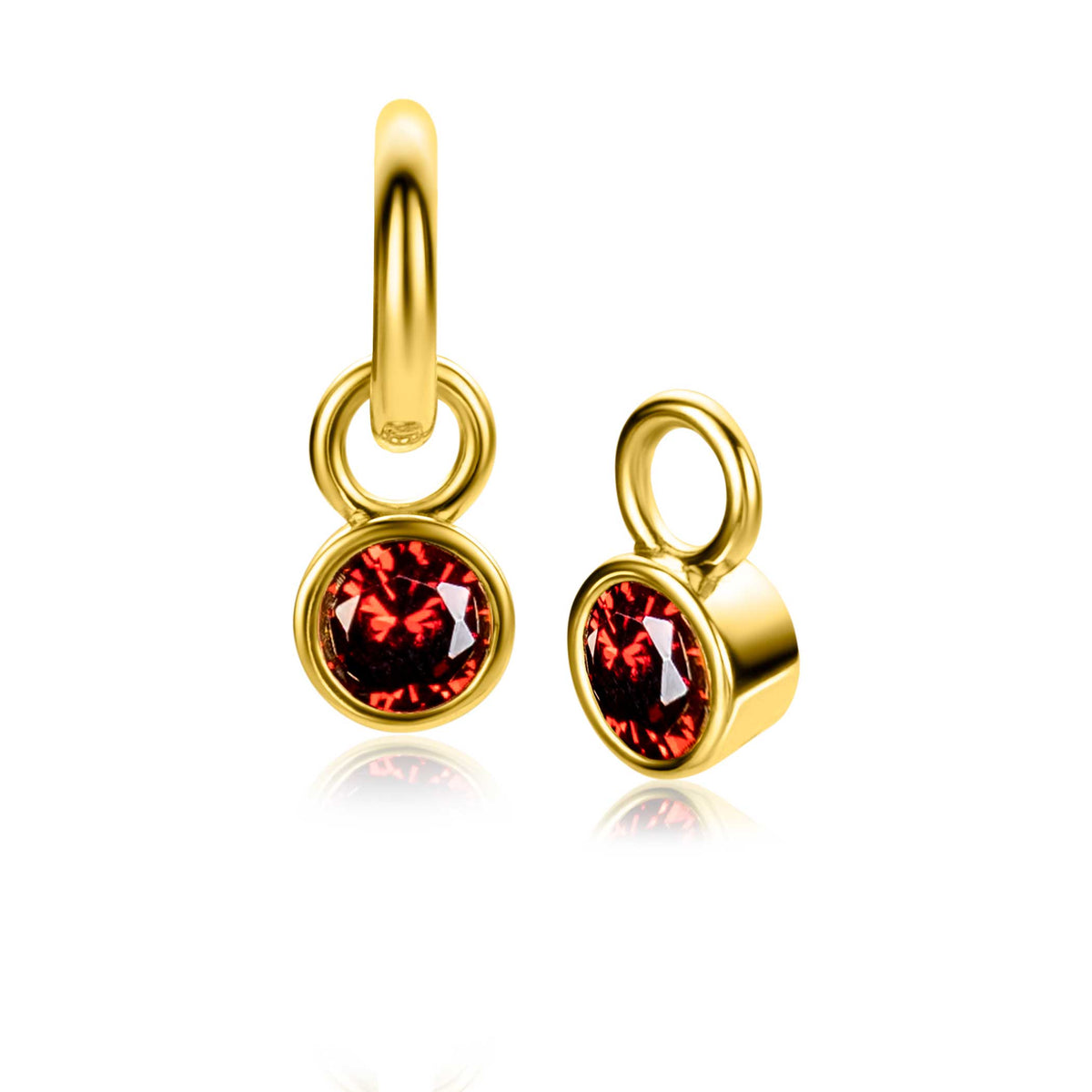 Pendientes de aro dorados con un charm redondo y una piedra roja brillante.