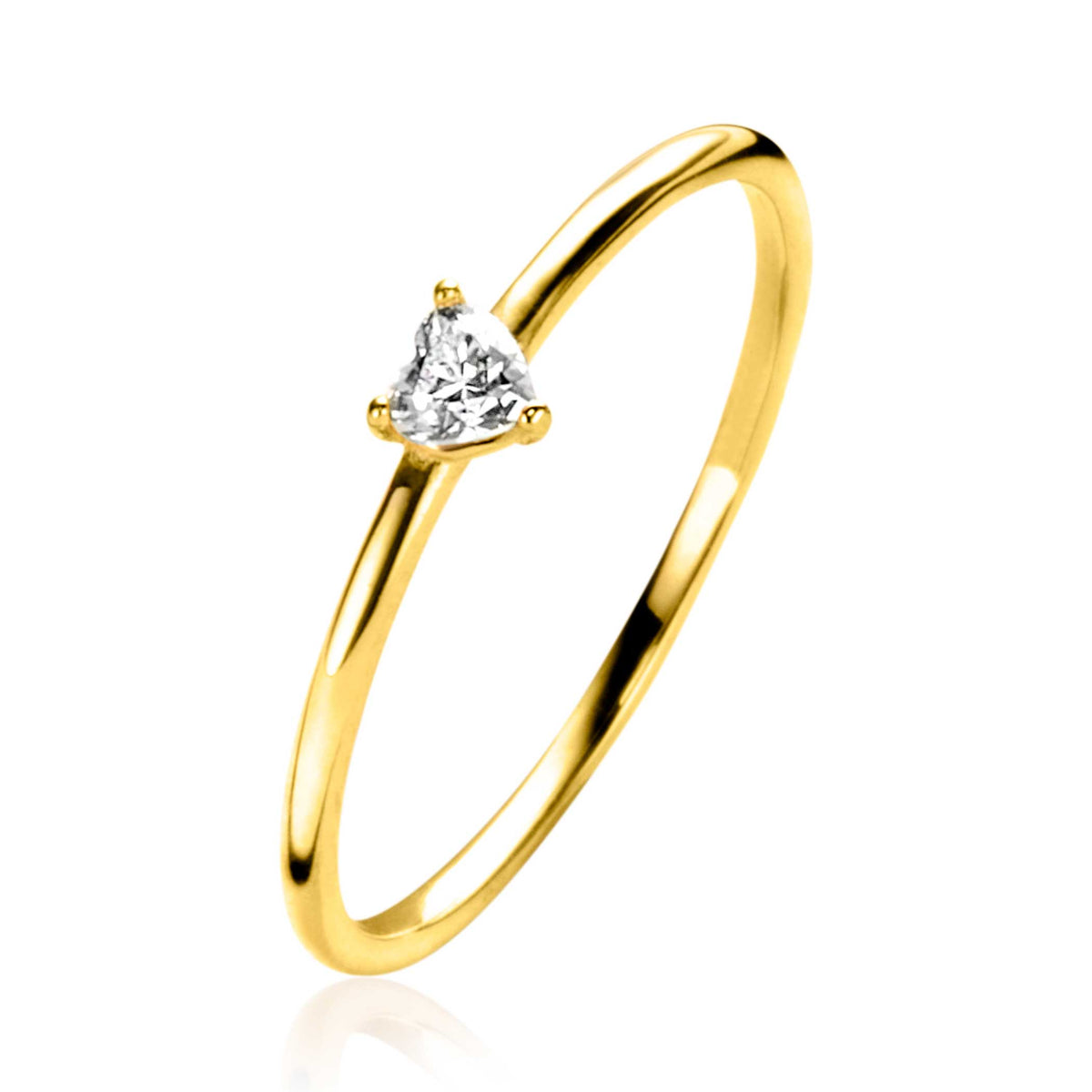 Anillo dorado con una piedra en forma de corazón en el centro.