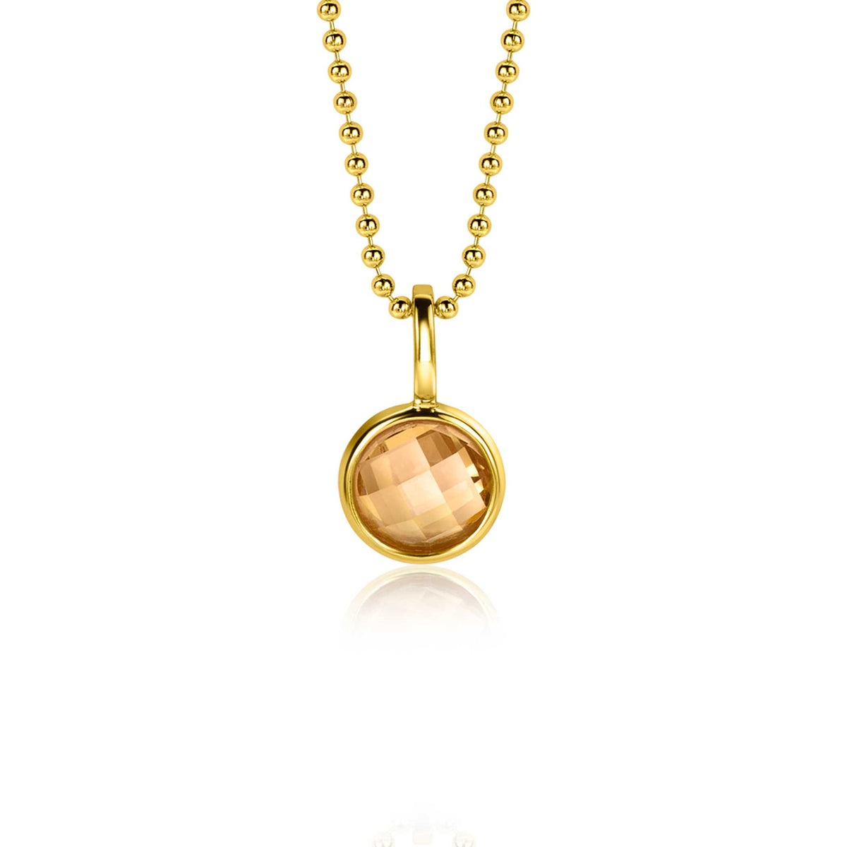 Colgante dorado con piedra amarilla en cadena de bolitas.