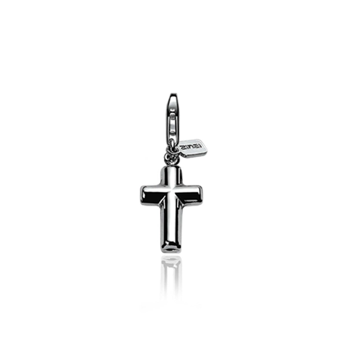 Colgante de plata en forma de cruz con un pequeño charm adjunto.