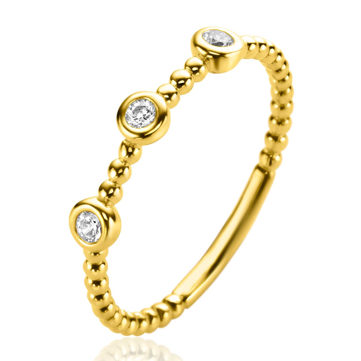 Anillo dorado con tres circonitas engastadas y diseño de bolitas.