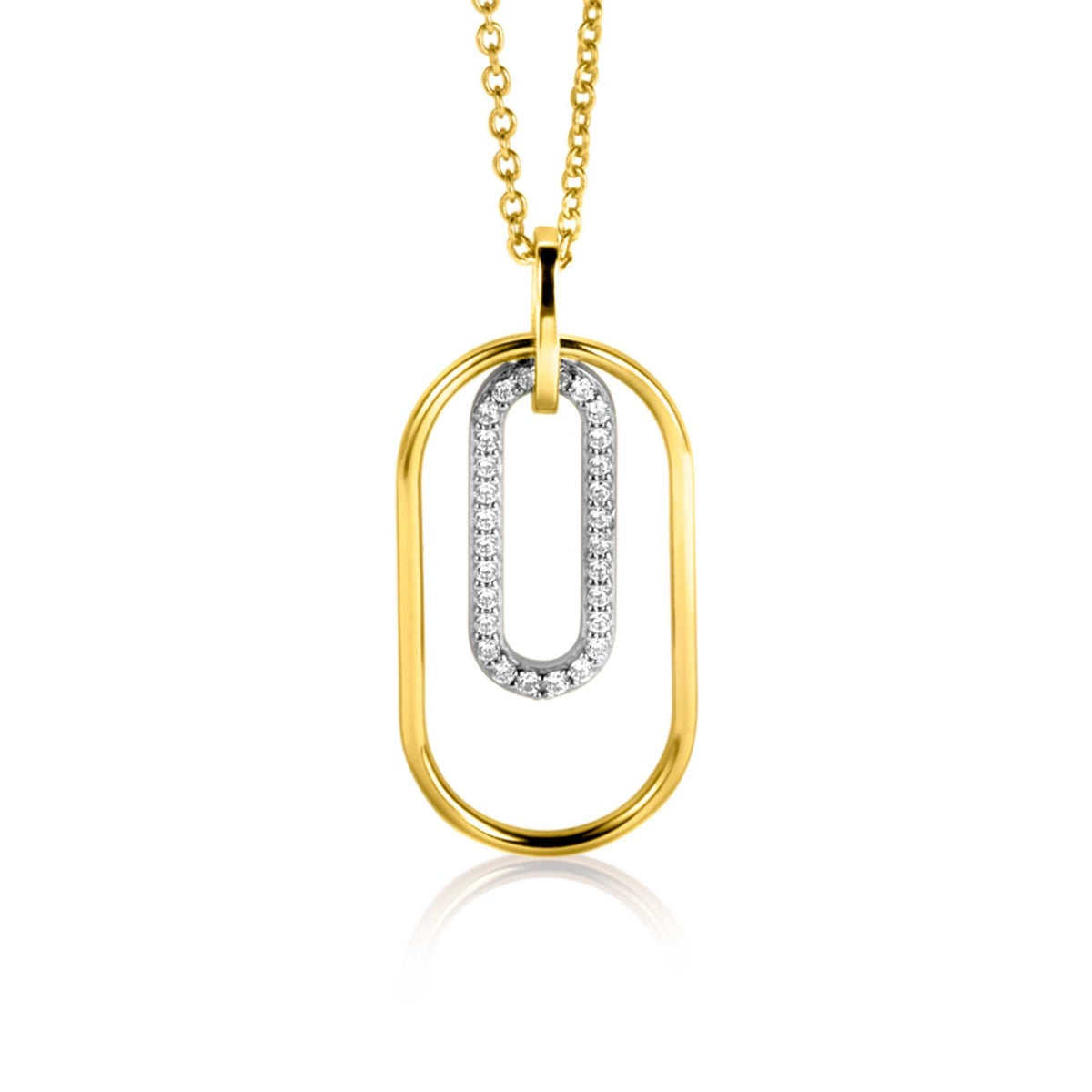 Colgante dorado con forma ovalada y detalles en plata con piedras brillantes.